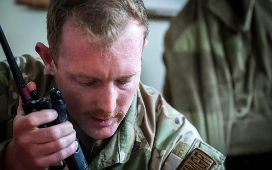 U.S. Air Force Tech. Sgt. John Ward, 18th Maintenance Operations Squadron maintenance manager, speaks into a land mobile radio during a USAF-led operational exercise Beverly Midnight 26.